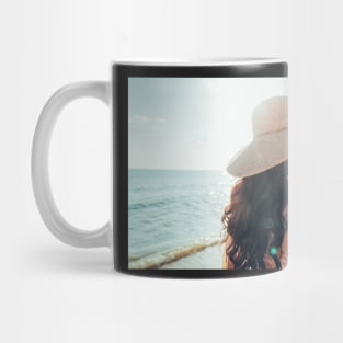 Elegant Woman With Straw Hat Walking Alone on Beach Mug